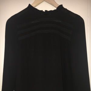 Black collared blouse.